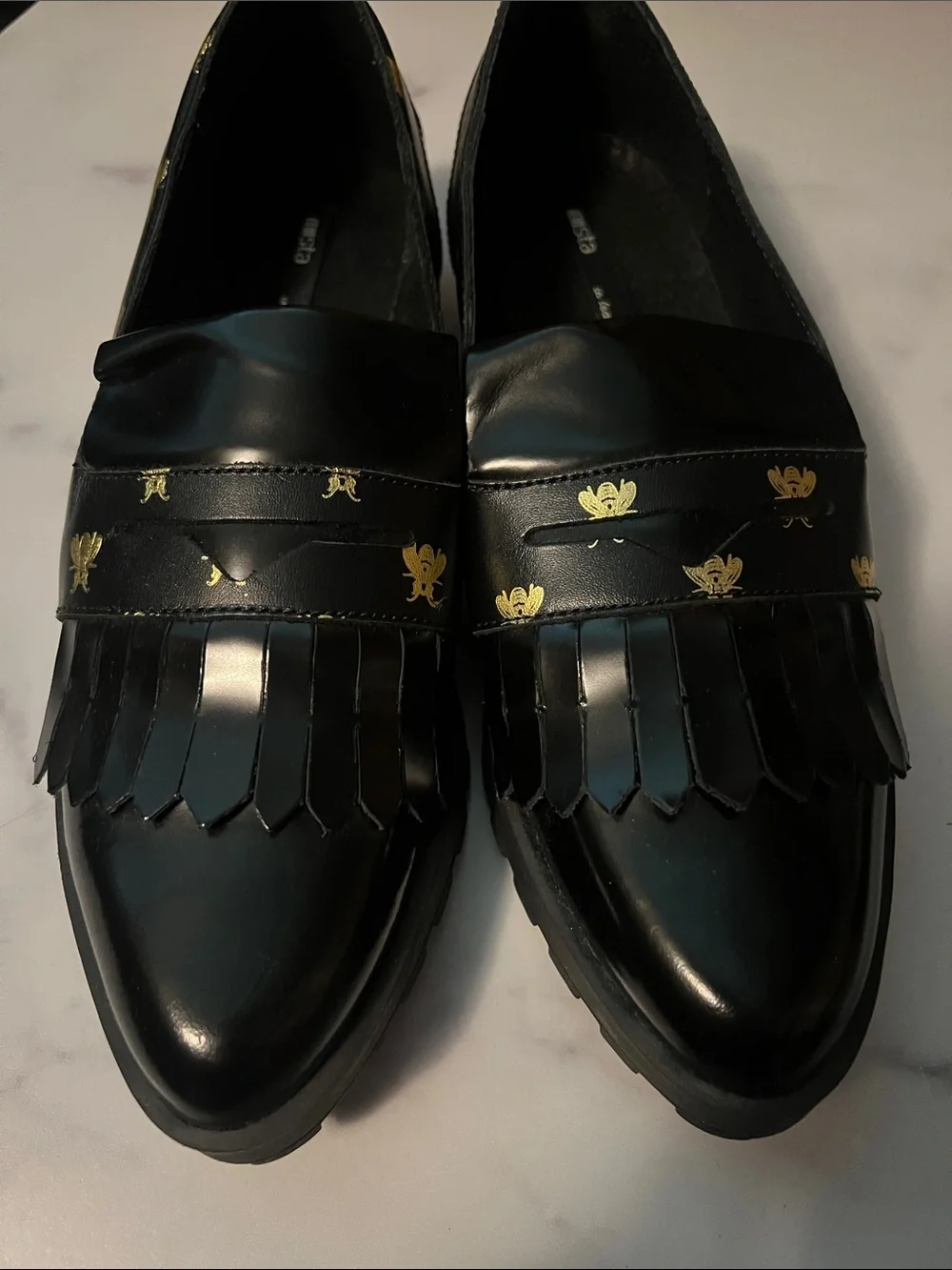 Miista Black Leather Bee-Print Kiltie Loafers